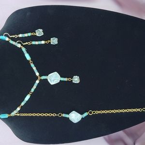 Handcrafted glass beads necklace bracelet and earring set done in a white crysta